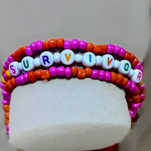 Stackable Bracelets – SURVIVOR: A Symbol of Strength and Hope