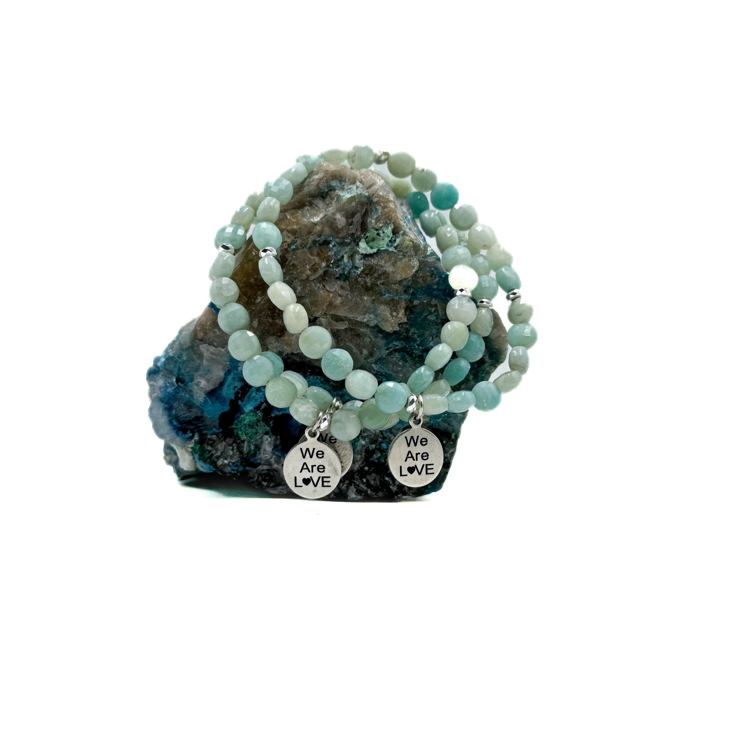 Chalcedony stone with light facets beaded bracelet and a "We Are Love" charm.
